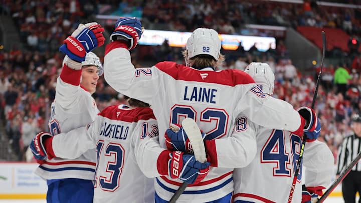 Mar 30, 2025; Sunrise, Florida, USA; Montreal Canadiens right wing Patrik Laine (92) celebrates with teammates after scoring against the Florida Panthers during the first period at Amerant Bank Arena. Mandatory Credit: Sam Navarro-Imagn Images
