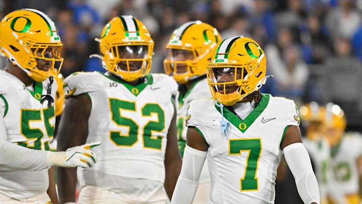 Sep 28, 2024; Pasadena, California, Oregon Ducks defensive linemen Derrick Harmon (55), Oregon Ducks A'Mauri Washington (52) and defensive back Jabbar Muhammad (7) in the third quarter against the UCLA Bruins at Rose Bowl. Mandatory Credit: Robert Hanashiro-Imagn Images