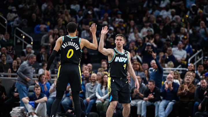 Apr 7, 2024; Indianapolis, Indiana, USA;  Indiana Pacers guard Tyrese Haliburton (0) and guard T.J.