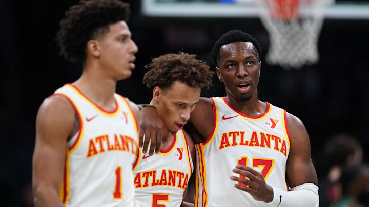 Nov 12, 2024; Boston, Massachusetts, USA; Atlanta Hawks forward Onyeka Okongwu (17), guard Dyson Daniels (5) and forward Jalen Johnson (1) walk to the bench during a break in the action against the Boston Celtics in the second half at TD Garden. Mandatory Credit: David Butler II-Imagn Images