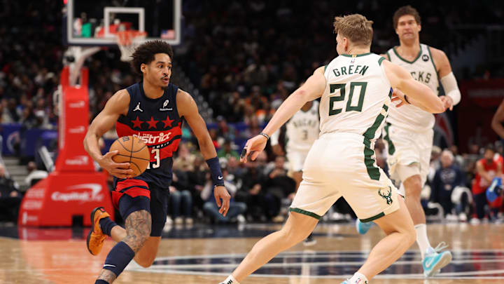Feb 21, 2025; Washington, District of Columbia, USA; Washington Wizards guard Jordan Poole (13) drives to the basket as Milwaukee Bucks guard AJ Green (20) defends in the second half at Capital One Arena. Mandatory Credit: Geoff Burke-Imagn Images