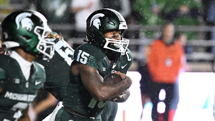 Sep 21, 2024; Chestnut Hill, Massachusetts, USA; Michigan State Spartans running back Kay'Ron Lynch-Adams (15) runs the ball against the Boston College Eagles during the first half at Alumni Stadium. Mandatory Credit: Eric Canha-Imagn Images