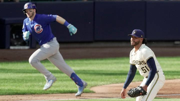Milwaukee Brewers pitcher Freddy Peralta watches a home run by Chicago Cubs left fielder Ian Happ. Milwaukee Brewers pitcher Freddy Peralta watches a home run by Chicago Cubs left fielder Ian Happ.