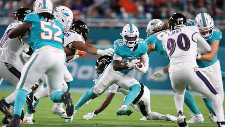 Miami Dolphins running back De'Von Achane (28) runs for a gain during the first quarter against the Baltimore Ravens at Hard Rock Stadium. 