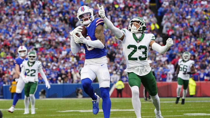 Dec 29, 2024; Orchard Park, New York, USA; Buffalo Bills wide receiver Keon Coleman (0) makes a catch against New York Jets cornerback Isaiah Oliver (23) during the first half at Highmark Stadium