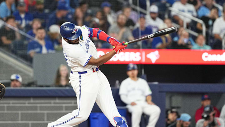 Toronto Blue Jays first base Vladimir Guerrero Jr. (27) takes a ball off the ankle against the Miami Marlins during the fifth inning at Rogers Centre on Sept 27. Toronto Blue Jays first base Vladimir Guerrero Jr. (27) takes a ball off the ankle against the Miami Marlins during the fifth inning at Rogers Centre on Sept 27.