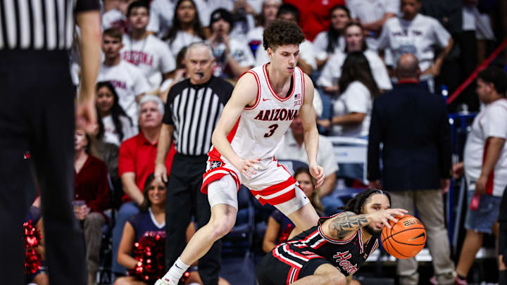 Feb 15, 2025; Tucson, Arizona, USA; Houston Cougars guard Emanuel Sharp (21) attempts to keep control over the ball while Arizona Wildcats guard Anthony Dell’Orso (3) is ready to take it during the second half at McKale Center. Mandatory Credit: Aryanna Frank-Imagn Images