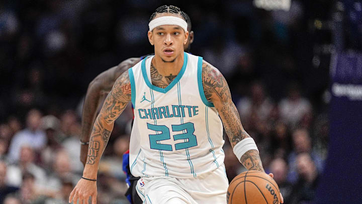 Nov 6, 2024; Charlotte, North Carolina, USA; Charlotte Hornets guard Tre Mann (23) handles the ball against the Detroit Pistons during the second half at Spectrum Center. Mandatory Credit: Jim Dedmon-Imagn Images