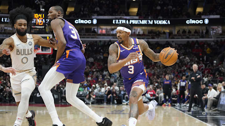 Feb 22, 2025; Chicago, Illinois, USA; Chicago Bulls guard Coby White (0) defends Phoenix Suns guard Bradley Beal (3) during the first quarter at United Center. Mandatory Credit: David Banks-Imagn Images