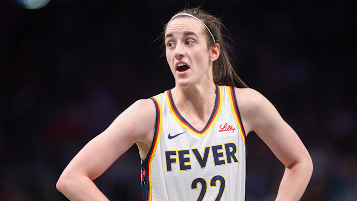 Indiana Fever guard Caitlin Clark (22) talks to a referee against the Atlanta Dream in the first half at State Farm Arena. Mandatory Credit: Brett Davis-Imagn Images
