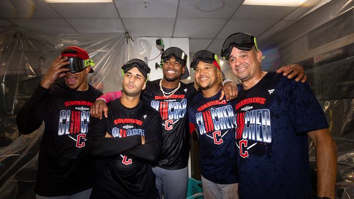 Sep 24, 2026; Boston, Massachusetts, USA; Cleveland Guardians left fielder Angel Martinez (1) and shortstop Brayan Rocchio (4) and third baseman Jose Ramirez (11) celebrate after clinching a playoff berth at Fenway Park after a game against the Boston Red Sox. Mandatory Credit: Paul Rutherford-Imagn Images