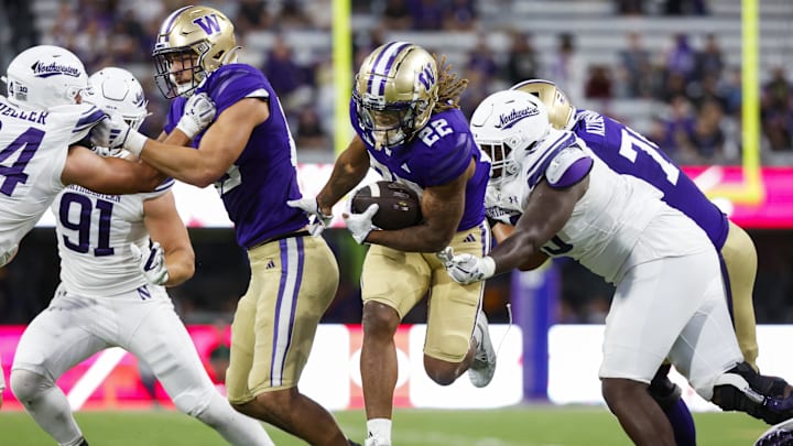 Sep 21, 2024; Seattle, Washington, USA; Washington Huskies running back Cameron Davis (22) rushes against the Northwestern Wildcats during the fourth quarter at Alaska Airlines Field at Husky Stadium. Washington Huskies tight end Keleki Latu (85) blocks at left. Mandatory Credit: Joe Nicholson-Imagn Images