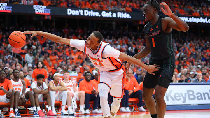 Jan 20, 2024; Syracuse, New York, USA; Syracuse Orange guard Quadir Copeland (24) reaches to save a