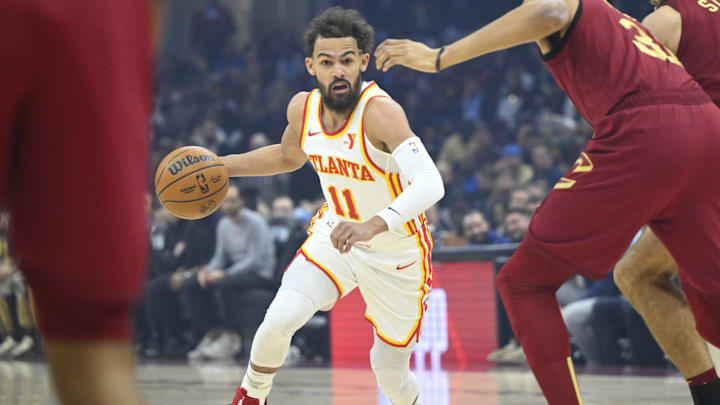 Jan 30, 2025; Cleveland, Ohio, USA; Atlanta Hawks guard Trae Young (11) dribbles against the Cleveland Cavaliers in the first quarter at Rocket Mortgage FieldHouse. Mandatory Credit: David Richard-Imagn Images