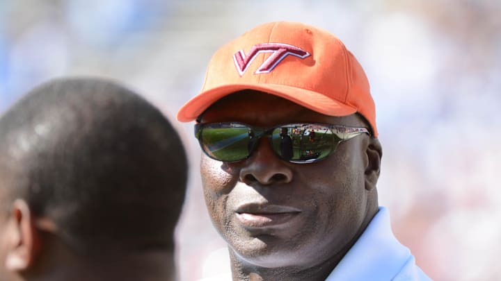 Oct 4, 2014; Chapel Hill, NC, USA; NFL and Virginia Tech Hokies former defensive end Bruce Smith watches his team during the second half against the North Carolina Tar Heels at Kenan Memorial Stadium. The Virginia Tech Hokies won 34-17. Mandatory Credit: Rob Kinnan-Imagn Images Oct 4, 2014; Chapel Hill, NC, USA; NFL and Virginia Tech Hokies former defensive end Bruce Smith watches his team during the second half against the North Carolina Tar Heels at Kenan Memorial Stadium. The Virginia Tech Hokies won 34-17. Mandatory Credit: Rob Kinnan-Imagn Images