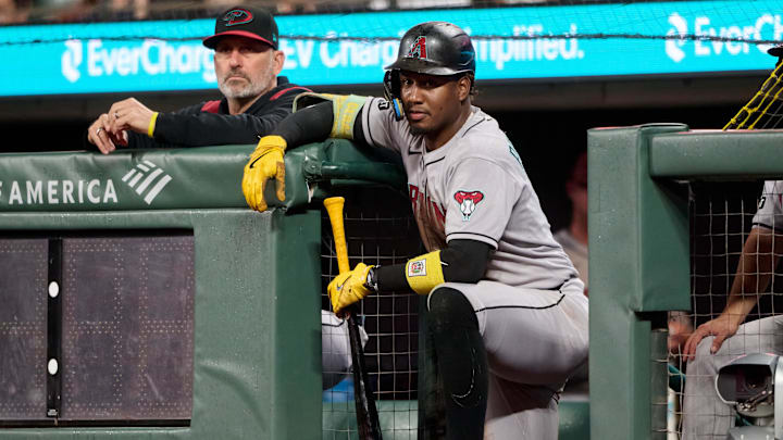 Sep 9, 2025; San Francisco, California, USA; Arizona Diamondbacks manager Torey Lovullo (17) (left) and infielder Geraldo Perdomo (2) watch game play against the San Francisco Giants during the sixth inning at Oracle Park. Mandatory Credit: Robert Edwards-Imagn Images