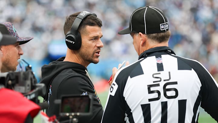 Oct 12, 2025; Charlotte, North Carolina, USA; Carolina Panthers head coach Dave Canales speaks with the referee during the second half against the Dallas Cowboys at Bank of America Stadium. Mandatory Credit: Cory Knowlton-Imagn Images