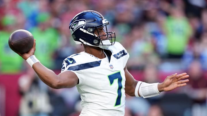 Dec 8, 2024; Glendale, Arizona, USA; Seattle Seahawks quarterback Geno Smith (7) throws against the Arizona Cardinals during the second half at State Farm Stadium. Mandatory Credit: Joe Camporeale-Imagn Images