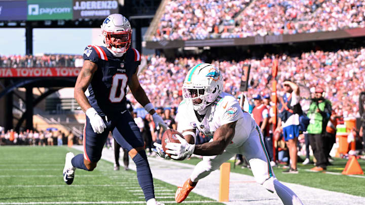 Oct 6, 2024; Foxborough, Massachusetts, USA; Miami Dolphins wide receiver Tyreek Hill (10) steps out of bounds in the end zone in front of New England Patriots cornerback Christian Gonzalez (0) during the second half at Gillette Stadium. Mandatory Credit: Brian Fluharty-Imagn Images Oct 6, 2024; Foxborough, Massachusetts, USA; Miami Dolphins wide receiver Tyreek Hill (10) steps out of bounds in the end zone in front of New England Patriots cornerback Christian Gonzalez (0) during the second half at Gillette Stadium. Mandatory Credit: Brian Fluharty-Imagn Images