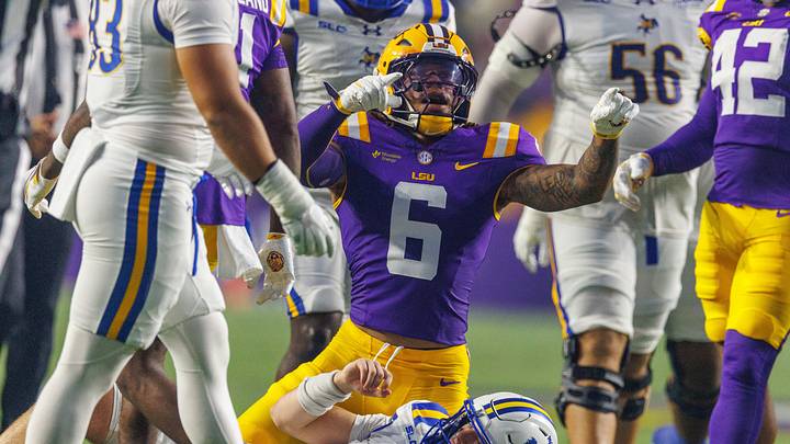 Oct 3, 2026; Baton Rouge, Louisiana, USA; LSU Tigers linebacker TJ Dottery (6) sacks McNeese Cowboys quarterback Jake Strong (4) during the first half at Tiger Stadium. Mandatory Credit: Stephen Lew-Imagn Images Oct 3, 2026; Baton Rouge, Louisiana, USA; LSU Tigers linebacker TJ Dottery (6) sacks McNeese Cowboys quarterback Jake Strong (4) during the first half at Tiger Stadium. Mandatory Credit: Stephen Lew-Imagn Images
