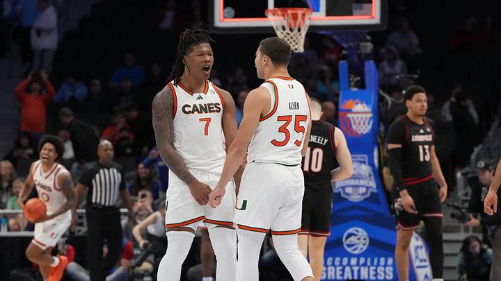 Mar 12, 2026; Charlotte, NC, USA; Miami (FL) Hurricanes forward Shelton Henderson (7) and guard Dante Allen (35) celebrate at the end of the game at Spectrum Center. Mandatory Credit: Bob Donnan-Imagn Images