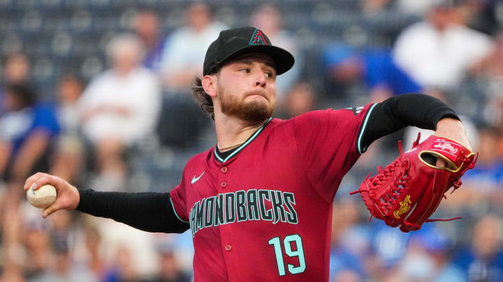 Jul 24, 2024; Kansas City, Missouri, USA; Arizona Diamondbacks starting pitcher Ryne Nelson (19) delivers a pitch against the Kansas City Royals in the first inning at Kauffman Stadium. Mandatory Credit: Denny Medley-USA TODAY Sports