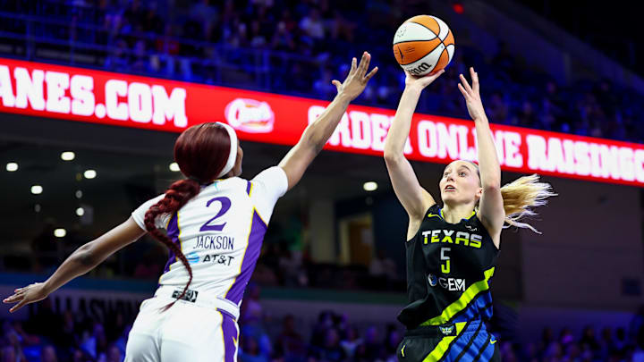 Aug 15, 2025; Arlington, Texas, USA;  Dallas Wings guard Paige Bueckers (5) shoots over Los Angeles Sparks forward Rickea Jackson (2) during the second half at College Park Center. Mandatory Credit: Kevin Jairaj-Imagn Images