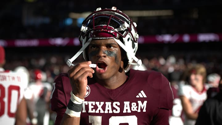 Sep 28, 2024; Arlington, Texas, USA; Texas A&M Aggies quarterback Marcel Reed (10) takes out his mouthguard after a win over the Arkansas Razorbacks at AT&T Stadium. Sep 28, 2024; Arlington, Texas, USA; Texas A&M Aggies quarterback Marcel Reed (10) takes out his mouthguard after a win over the Arkansas Razorbacks at AT&T Stadium.