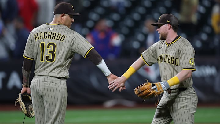 Sep 17, 2025; New York City, New York, USA; San Diego Padres second baseman Jake Cronenworth (9) celebrates with third baseman Manny Machado (13) after the game against the New York Mets at Citi Field. Mandatory Credit: Vincent Carchietta-Imagn Images