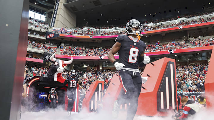 Dec 15, 2024; Houston Texans wide receiver John Metchie III (8) runs onto the field before the game against the Miami Dolphins at NRG Stadium. Mandatory Credit: Troy Taormina-Imagn Images Dec 15, 2024; Houston Texans wide receiver John Metchie III (8) runs onto the field before the game against the Miami Dolphins at NRG Stadium. Mandatory Credit: Troy Taormina-Imagn Images