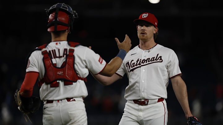 Apr 21, 2026; Washington, District of Columbia, USA; Washington Nationals pitcher Clayton Beeter (39) celebrates with Nationals catcher Drew Millas (14) after the final out against the Atlanta Braves at Nationals Park. Mandatory Credit: Geoff Burke-Imagn Images