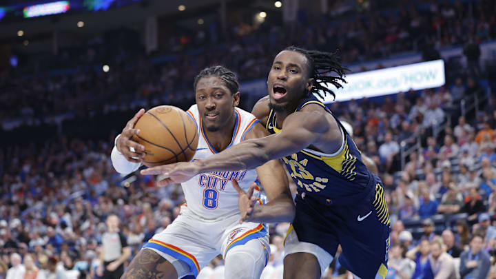 Mar 29, 2025; Oklahoma City, Oklahoma, USA; Indiana Pacers forward Aaron Nesmith (23) and Oklahoma City Thunder forward Jalen Williams (8) fight for control of the ball during the second half at Paycom Center. Mandatory Credit: Alonzo Adams-Imagn Images