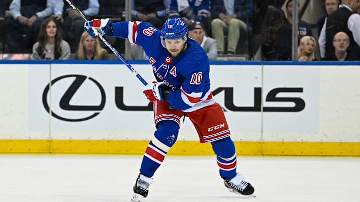 May 30, 2024; New York, New York, USA; New York Rangers left wing Artemi Panarin (10) lines up a shot against the Florida Panthers during the first period in game five of the Eastern Conference Final of the 2024 Stanley Cup Playoffs at Madison Square Garden. Mandatory Credit: Dennis Schneidler-Imagn Images