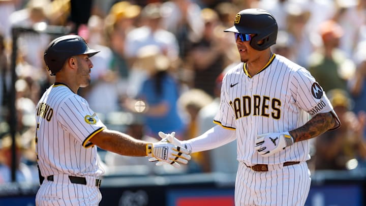 Sep 3, 2025; San Diego, California, USA; San Diego Padres third baseman Manny Machado (13) celebrates with left fielder Ramon Laureano (5) after hitting a two-run home run during the sixth inning against the Baltimore Orioles at Petco Park. Mandatory Credit: David Frerker-Imagn Images