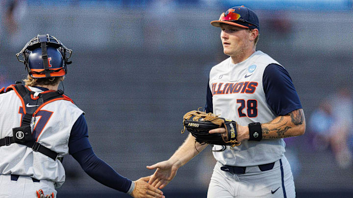May 31, 2024; Lexington, KY, USA; Illinois infielder Vytas Valincius (28) returns to the dugout during the sixth inning of a NCAA Division I Baseball Championship game between the Indiana State Sycamores and Illinois Fighting Illini at Kentucky Proud Park. Mandatory Credit: Jordan Prather-Imagn Images