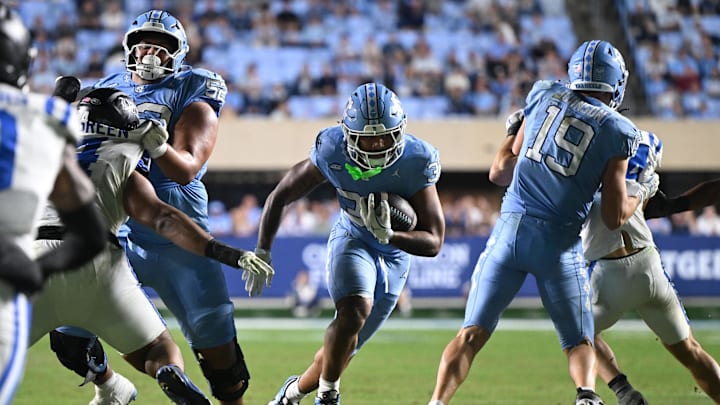 Nov 22, 2025; Chapel Hill, North Carolina, USA; North Carolina Tar Heels running back Davion Gause (37) rushes the ball against Duke during the second half at Kenan Stadium. Mandatory Credit: William Howard-Imagn Images