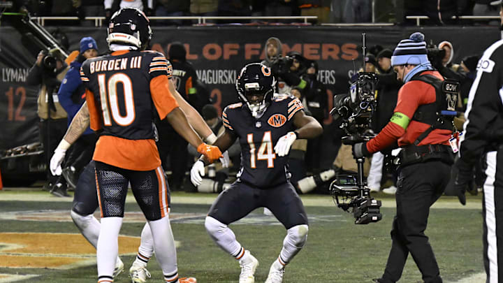 Jan 10, 2026; Chicago, IL, USA;  Chicago Bears wide receiver Olamide Zaccheaus (14) reacts with teammates after a touchdown catch against the Green Bay Packers during the second half of an NFC Wild Card Round game at Soldier Field. Mandatory Credit: Matt Marton-Imagn Images