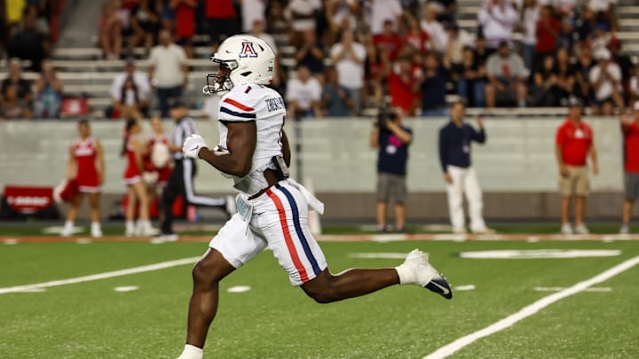 Aug 31, 2024; Tucson, Arizona, USA; Arizona Wildcats running back Jacory Croskey-Merritt (1) runs the ball for a touchdown during fourth quarter at Arizona Stadium. Aug 31, 2024; Tucson, Arizona, USA; Arizona Wildcats running back Jacory Croskey-Merritt (1) runs the ball for a touchdown during fourth quarter at Arizona Stadium.