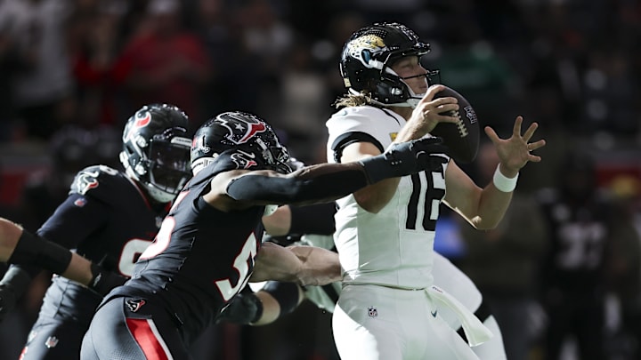 Nov 9, 2025; Houston, Texas, USA; Houston Texans defensive end Danielle Hunter (55) attempts to sack Jacksonville Jaguars quarterback Trevor Lawrence (16) during the fourth quarter at NRG Stadium. Mandatory Credit: Troy Taormina-Imagn Images