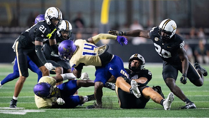 Alcorn State Braves wide receiver Anthony Williams (14) is tackled by Vanderbilt Commodores linebacker Nicholas Rinaldi (24) during their Southeastern Athletic Conference game at FirstBank Stadium in Nashville, Tenn., Saturday, Sept. 7, 2024.