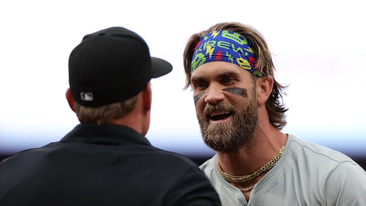 May 24, 2024; Denver, Colorado, USA; Philadelphia Phillies first baseman Bryce Harper (3) argues with home plate umpire Brian Walsh (120) after being ejected in the first inning against the Colorado Rockies at Coors Field. Mandatory Credit: Isaiah J. Downing-USA TODAY Sports