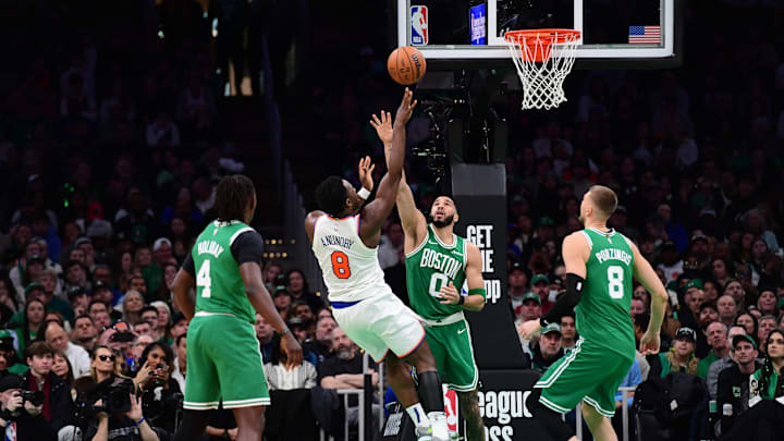 Feb 23, 2025; Boston, Massachusetts, USA;  New York Knicks forward OG Anunoby (8) shoots the ball over Boston Celtics forward Jayson Tatum (0) during the second half at TD Garden. Mandatory Credit: Bob DeChiara-Imagn Images