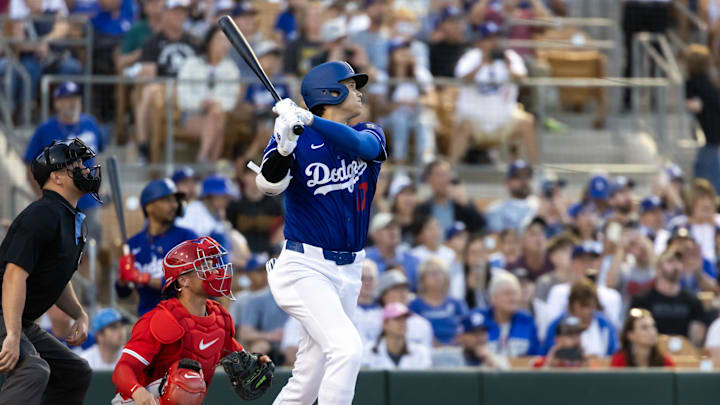 Feb 28, 2025; Phoenix, Arizona, USA; Los Angeles Dodgers designated hitter Shohei Ohtani (17) hits a leadoff home run against the Los Angeles Angels during a spring training game at Camelback Ranch-Glendale. Mandatory Credit: Mark J. Rebilas-Imagn Images Feb 28, 2025; Phoenix, Arizona, USA; Los Angeles Dodgers designated hitter Shohei Ohtani (17) hits a leadoff home run against the Los Angeles Angels during a spring training game at Camelback Ranch-Glendale. Mandatory Credit: Mark J. Rebilas-Imagn Images