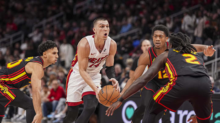Dec 28, 2024; Atlanta, Georgia, USA; Miami Heat guard Tyler Herro (14) tries to get to the basket against the Atlanta Hawks at State Farm Arena. Mandatory Credit: Dale Zanine-Imagn Images
