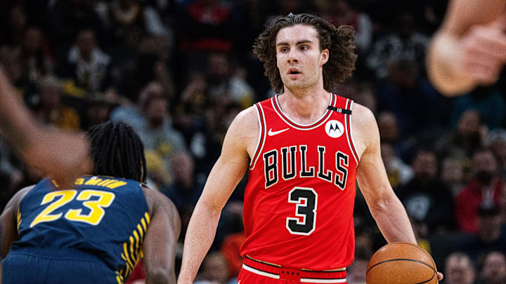 Mar 2, 2025; Indianapolis, Indiana, USA; Chicago Bulls guard Josh Giddey (3) dribbles the ball while Indiana Pacers forward Aaron Nesmith (23) defends