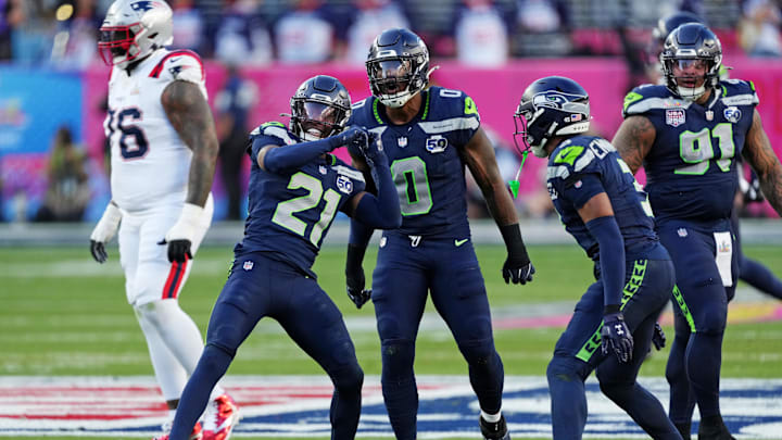 Feb 8, 2026; Santa Clara, CA, USA; Seattle Seahawks defensive end DeMarcus Lawrence (0) and Seattle Seahawks cornerback Devon Witherspoon (21) react after a play during the first quarter against the New England Patriots in Super Bowl LX at Levi's Stadium. Mandatory Credit: Cary Edmondson-Imagn Images
