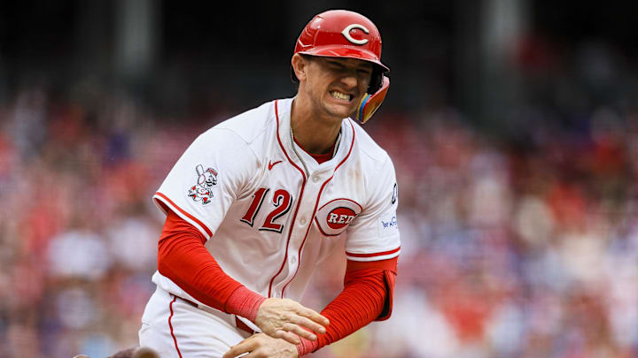 May 25, 2025; Cincinnati, Ohio, USA; Cincinnati Reds outfielder Austin Hays (12) reacts after getting hit by a wild pitch in the seventh inning against the Chicago Cubs at Great American Ball Park. Mandatory Credit: Katie Stratman-Imagn Images