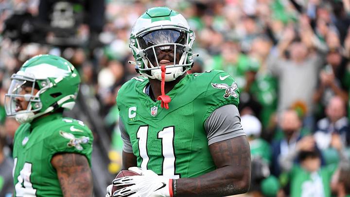 Dec 29, 2024; Philadelphia, Pennsylvania, USA; Philadelphia Eagles wide receiver A.J. Brown (11) throws the football into the stands after scoring a touchdown  during the third quarter against the Dallas Cowboys at Lincoln Financial Field. Mandatory Credit: Eric Hartline-Imagn Images