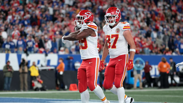 Sep 21, 2025; East Rutherford, New Jersey, USA; Kansas City Chiefs running back Kareem Hunt (29) celebrates with tight end Travis Kelce (87) after scoring a touchdown against the New York Giants in the fourth quarte at MetLife Stadium. Mandatory Credit: Vincent Carchietta-Imagn Images