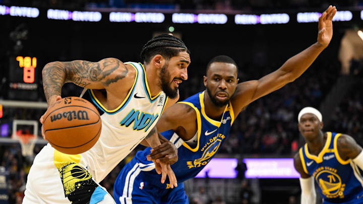Dec 23, 2024; San Francisco, California, USA; Indiana Pacers forward Obi Toppin (1) drives to the basket against Golden State Warriors forward Andrew Wiggins (22) in the second quarter at Chase Center. Mandatory Credit: Eakin Howard-Imagn Images